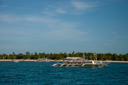 Dive boats moored off the beach in Malapascua island, Philippinesのeditorial素材