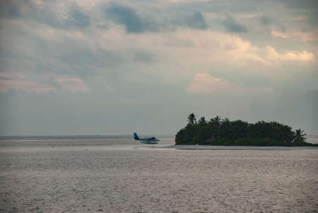A seaplane ferrying holidaymakers around the Maldives in the Indian Oceanの写真素材