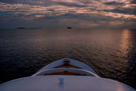 Luxury yacht in the Maldives at sunset