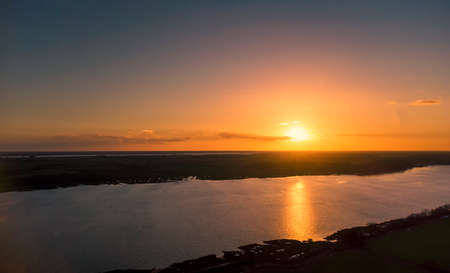 View of the River Orwell from a drone at sunset in Suffolk, UK