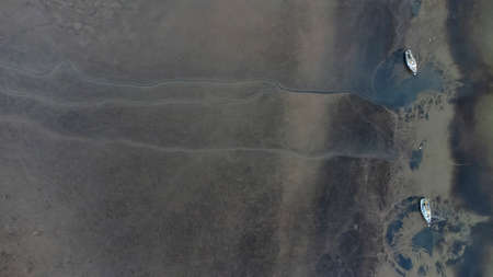 Looking down straight down from a drone on the banks of the River Orwell in Suffolk, UKの写真素材