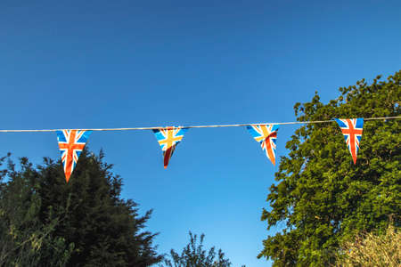 Union flag bunting on display in a village in Suffolk, UK