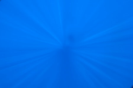 Sunlight beaming down through the clear blue water of the Caribbean Sea near Roseau, Dominicaの写真素材