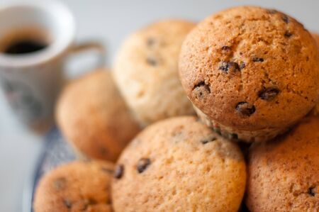 Home made chocolate chip muffins or cup cakes,with an esspresso coffee.の写真素材