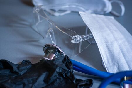 medical Protective mask & glasses with gloves & stethoscope, protection from covid 19, health care.の写真素材