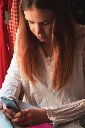 young female student studying from home, E learning, during coronavirus lockdown.の写真素材