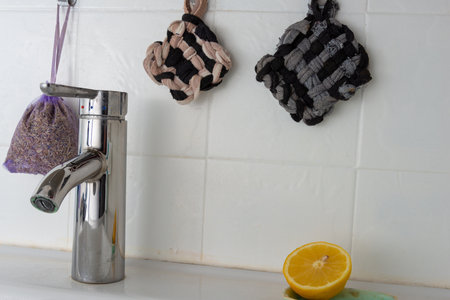 Tawashi reusable sponge and cut lemon in bathroom for cleaning zero waste .eco freindly.の写真素材