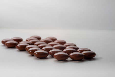 Natural Anti stress or sleeping tablets to help relax on white background, alternative herbal medicine.の写真素材