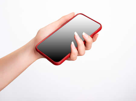 womans hand holding red smartphone with gradiant on white background. mockup.