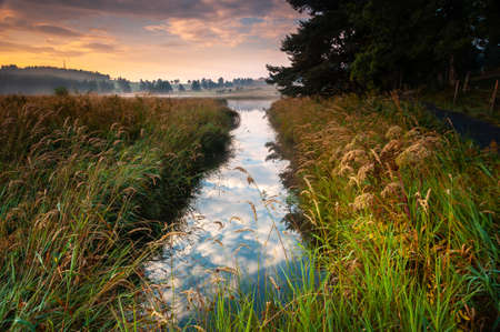 beautiful dawn light atMoulinet lake, landscape tourist destination, le Buisson, Lozere, Franceの写真素材
