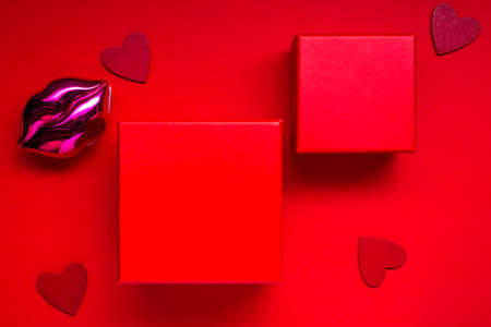 valentines mockup with red boxs or presents on a red background with hearts for your text.