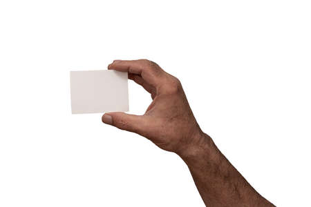 male hand holding blank white business card mock up against white background ,copy space .の写真素材
