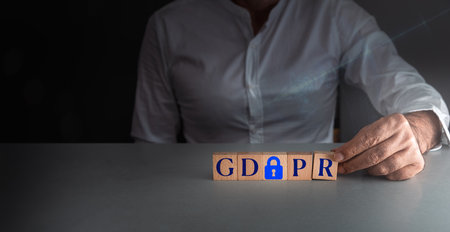 man posing wooden block gdph or general data protection regulation . concept of internet security .