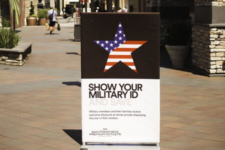 San Francisco, California /USA - June 16 2019 : Show your Military id and save sign with a American...