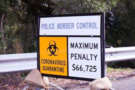 Queensland border, Australia April 09 2020: Sign on side of road Police border control , Coronavirus...