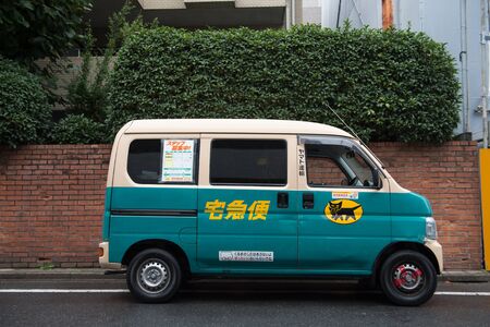 October 9, 2017: Yamato Transport Bicycle Deliver Letter Door to Door In Evening Time in Tokyo Japan on  October 9, 2017のeditorial素材