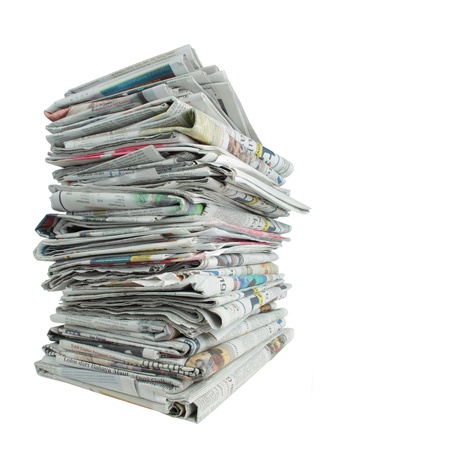 shot of stack of newspaper over white background