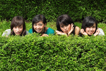 Smiling Happy girl friends in the parkの写真素材