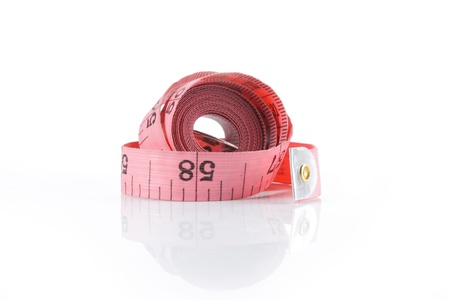 pink measuring tape isolated on white backgroundの写真素材