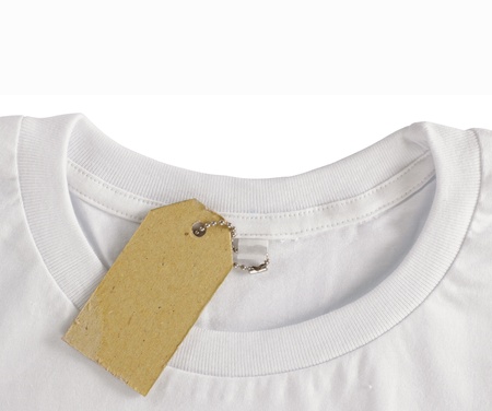 blank price tag hang over white tshirt. isolated over white background