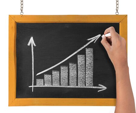hand drawing chart representing growth on blackboardの写真素材