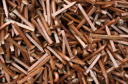 Thousands of rusty railway spikes.の写真素材