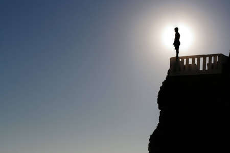 A man pepares to jump off a cliff in Mazatlan, Mexico.の写真素材