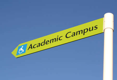 A sign points the way towards a new university.
