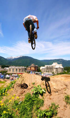 A mountainbiker floats through the air in Whistler, BC.の写真素材