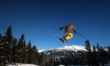 A skier coming in for a landing in Whistler, BC.の写真素材