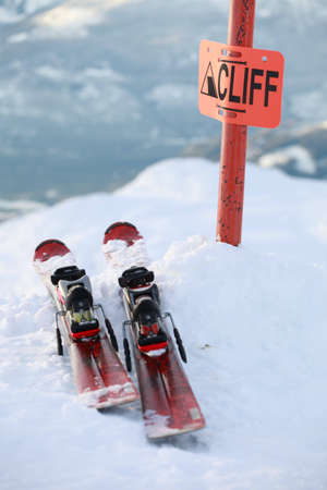 A pair of skis on the edge of a dangerous cliff in Whistler, BCの写真素材