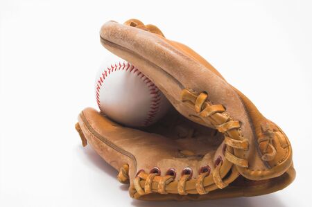 A baseball inside of a baseball glove.の写真素材