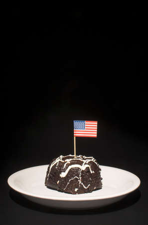 A piece of chocolate cake with the American flag.の写真素材