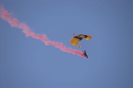 A US Army ranger parachuting from the sky.の写真素材