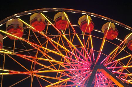 A large ferris wheel or big wheel at a fair.の写真素材