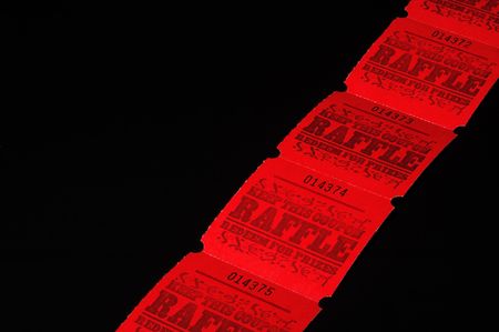 A strand of bright red rafflle tickets.の写真素材