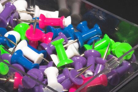 A collection of very colorful push pins.