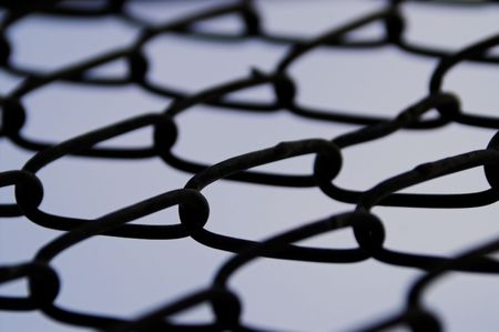 A chain link fence for keeping people out or keeping people in.