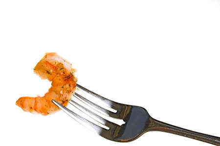 A fork full of delicious gourmet garlic shrimp..の写真素材