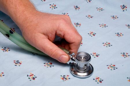 A patient being examined with a medical stethoscope..