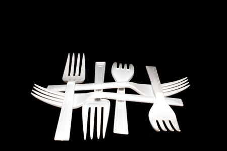 A collection of plastic forks in a pattern.の写真素材