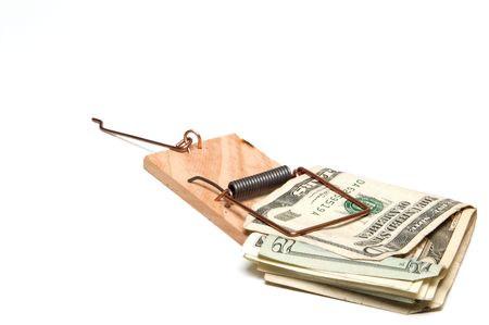 Denominations of merican currency in a mousetrap.