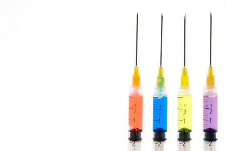A set of colorful syringes with various medications.の写真素材