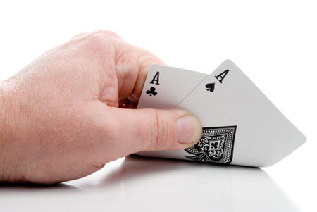 A poker player holding a pair of aces.のeditorial素材