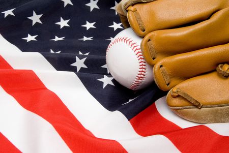 A Baseball and Glove on an American Flag.の写真素材