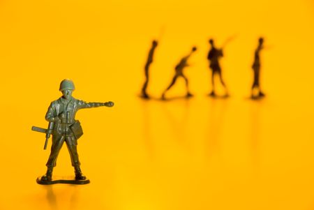 A group of toy soldiers on maneuvers.の写真素材