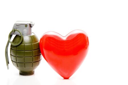 The concept of cardiovascular disease with a heart and grenade.の写真素材