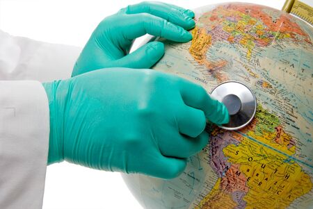 A doctor checking the health of the world.の写真素材