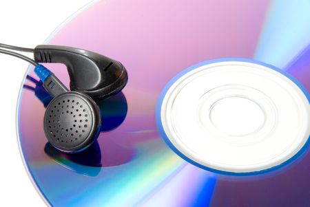 A pair of headphones and a compact disc.の写真素材