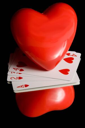 Heart and Playing Cards and thier reflection.
